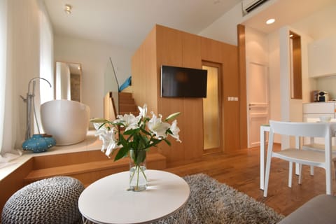 Deluxe Studio, Sea View | Living area | 102-cm flat-screen TV with satellite channels, Smart TV