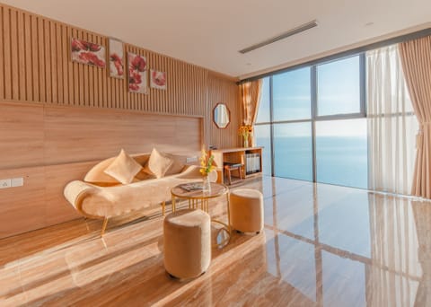 Suite, Ocean View | Living area | 23-inch flat-screen TV with cable channels, TV