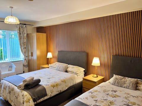 Triple Room | Desk, blackout drapes, iron/ironing board, free WiFi