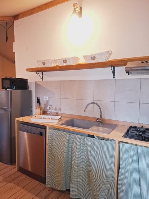 Luxury Bungalow, 2 Bedrooms, Mobility Accessible | Private kitchen | Full-size fridge, microwave, stovetop, coffee/tea maker