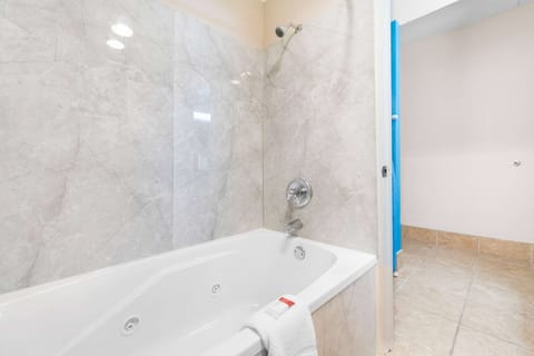 Combined shower/tub, eco-friendly toiletries, hair dryer, towels