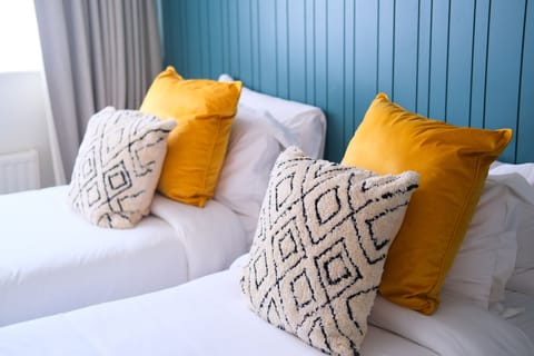 Twin Room | Iron/ironing board, free cribs/infant beds, free WiFi, bed sheets