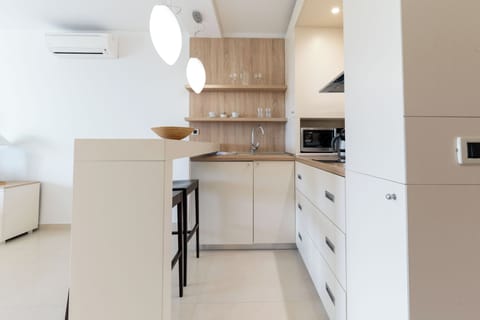 Superior Studio Suite, Balcony, Sea View | Private kitchen | Coffee/tea maker, electric kettle, cleaning supplies