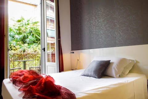 Basic Double Room, Shared Bathroom | Down comforters, minibar, desk, blackout drapes