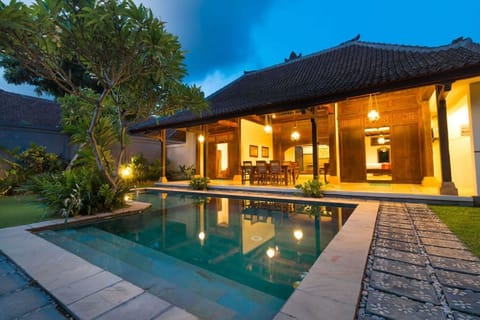 Standard Villa | Living area | 65-inch TV with cable channels