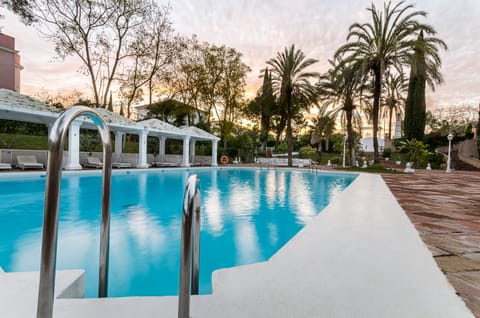 Seasonal outdoor pool, open 11 AM to 9 PM, pool umbrellas, sun loungers
