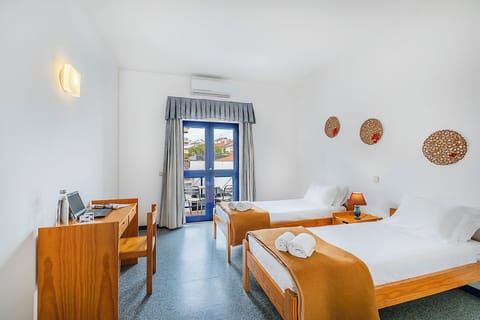 Twin Room, Shared Bathroom | Blackout drapes, free WiFi, bed sheets