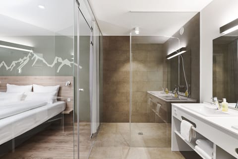 Suite | Bathroom | Shower, hair dryer, bathrobes, towels