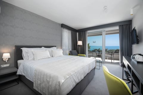 Standard Double Room, Sea View | Minibar, in-room safe, desk, laptop workspace