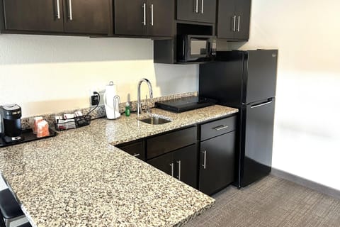 Premium bedding, desk, laptop workspace, blackout drapes