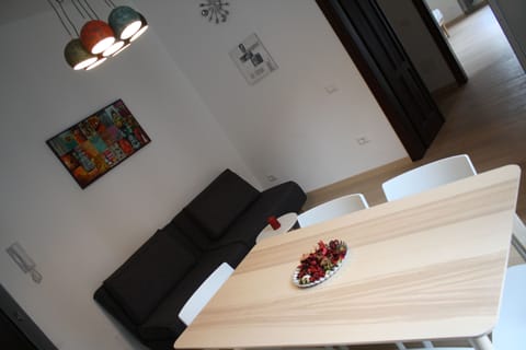 Deluxe Apartment, 1 Bedroom, Balcony, City View | Living area | Flat-screen TV