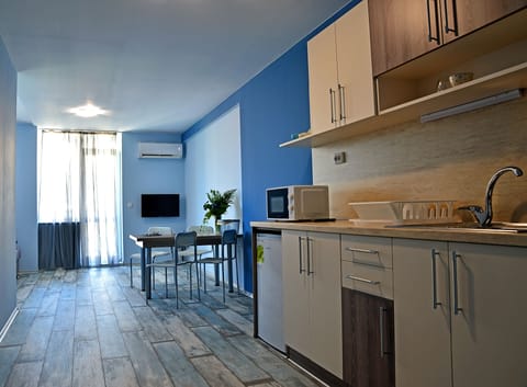 Blue Scene Apartment | Private kitchenette | Cookware/dishes/utensils