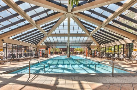 2 indoor pools, outdoor pool, open 8:00 AM to 10:00 PM, pool umbrellas