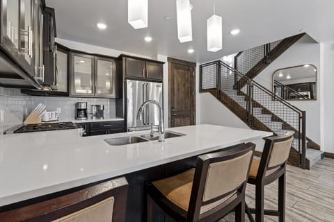 Deluxe Condo | Private kitchen | Full-size fridge, microwave, oven, stovetop