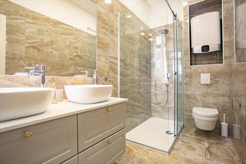 Shower, hair dryer, slippers, towels