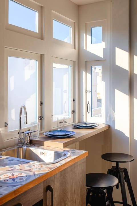 Fridge, coffee/tea maker, electric kettle, cookware/dishes/utensils