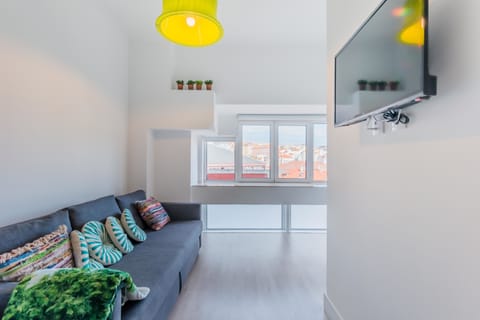 Panoramic Apartment, City View | Living area | Flat-screen TV