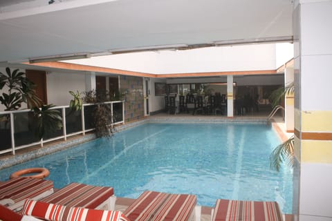 Outdoor pool, open 6:00 AM to 6:00 PM, sun loungers