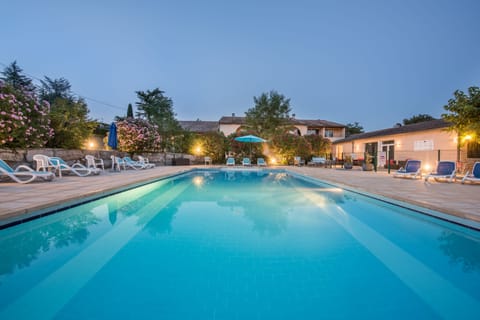 Seasonal outdoor pool, open 10:00 AM to 8:00 PM, pool umbrellas