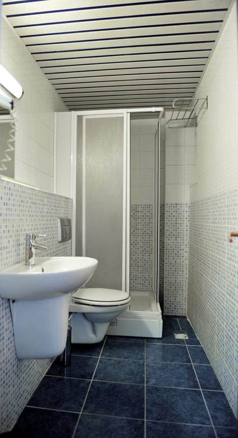 Shower, free toiletries, hair dryer, slippers