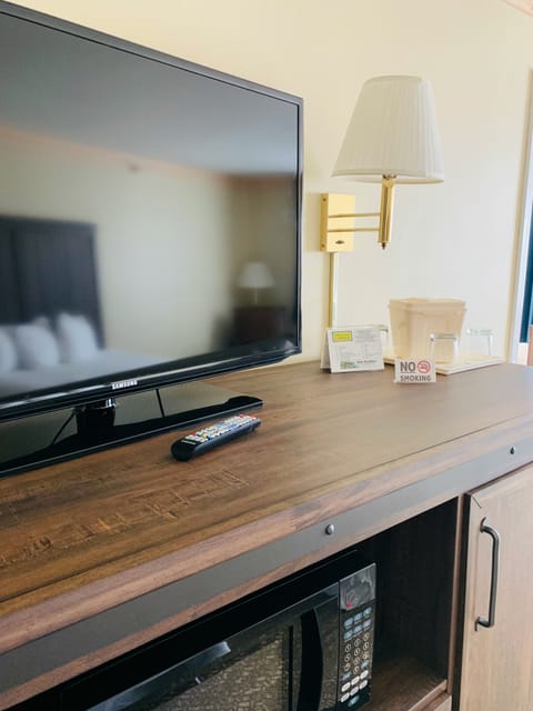 Desk, laptop workspace, blackout drapes, iron/ironing board