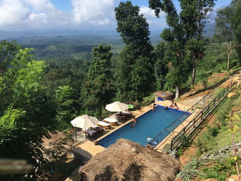 Outdoor pool, open 6:00 AM to 6:00 PM, pool umbrellas