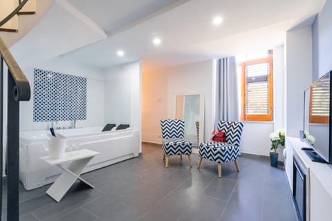 Romantic Room, Hot Tub | Living area | Flat-screen TV