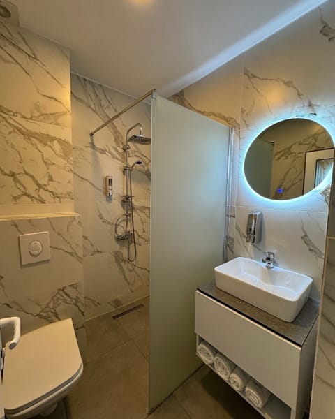 Shower, free toiletries, hair dryer, slippers