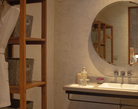 Antonieta Suite 1 | Bathroom | Shower, rainfall showerhead, hair dryer, slippers