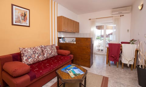 Economy Apartment, Terrace, Garden Area | Living room | 80-cm LCD TV with satellite channels, TV