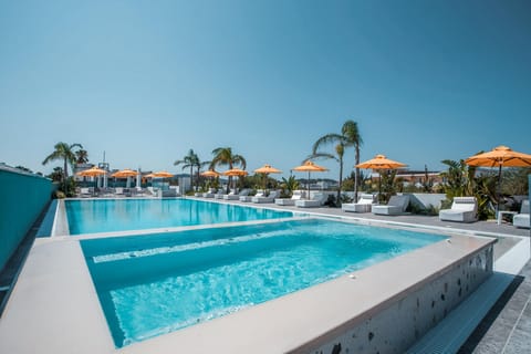 Outdoor pool, open 8:00 AM to 8:00 PM, pool umbrellas, sun loungers