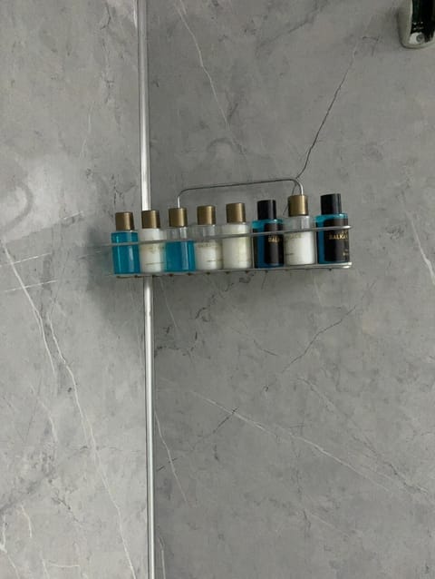 Shower, hair dryer, slippers, towels