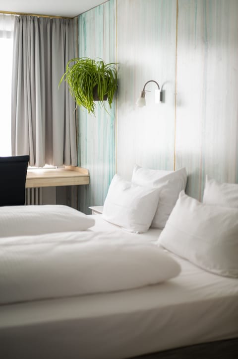 Hypo-allergenic bedding, desk, laptop workspace, iron/ironing board