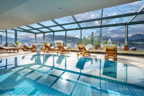 Indoor pool, seasonal outdoor pool, pool umbrellas, sun loungers