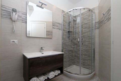 Shower, free toiletries, hair dryer, slippers