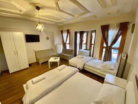 Deluxe Triple Room | Premium bedding, down comforters, in-room safe, desk