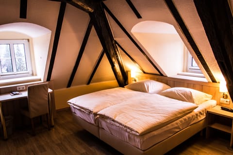 Hypo-allergenic bedding, desk, blackout drapes, cribs/infant beds