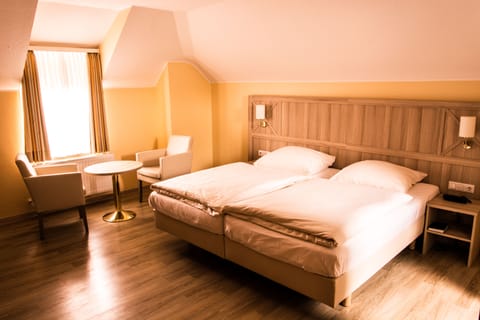 Hypo-allergenic bedding, desk, blackout drapes, cribs/infant beds