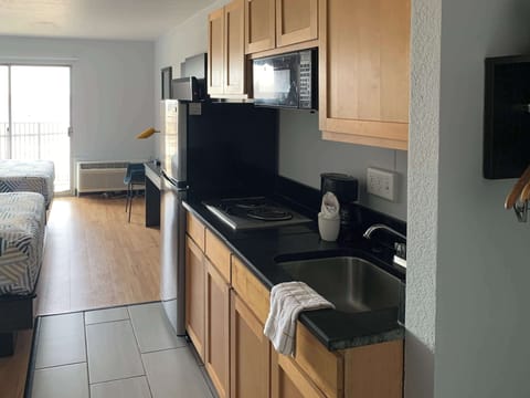 Deluxe Room, 2 Double Beds, Non Smoking, Kitchenette | Desk, laptop workspace, blackout drapes, iron/ironing board