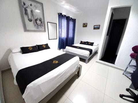 Standard Quadruple Room, Non Smoking (Cozumel) | Hypo-allergenic bedding, desk, laptop workspace, blackout drapes