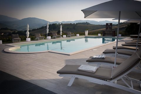 Seasonal outdoor pool, pool umbrellas, sun loungers