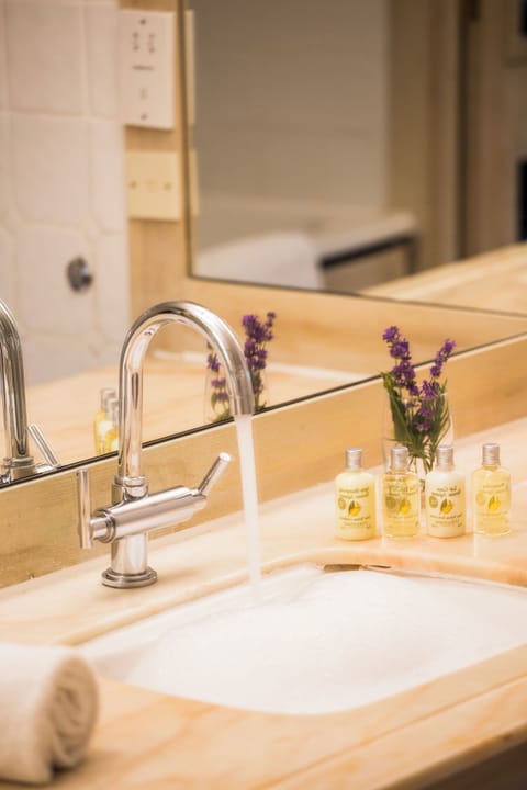 Designer toiletries, hair dryer, bathrobes, towels