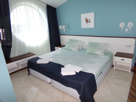 Classic Double or Twin Room, Balcony, Partial Sea View | Desk, laptop workspace, soundproofing, iron/ironing board