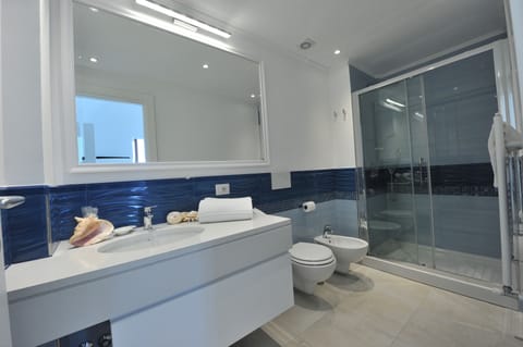 Family Quadruple Room, 1 Queen Bed with Sofa bed, Garden View | Bathroom | Shower, rainfall showerhead, free toiletries, hair dryer