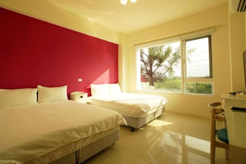 Economy Quadruple Room | Desk, blackout drapes, free WiFi, bed sheets