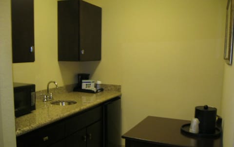 Desk, laptop workspace, iron/ironing board, cribs/infant beds