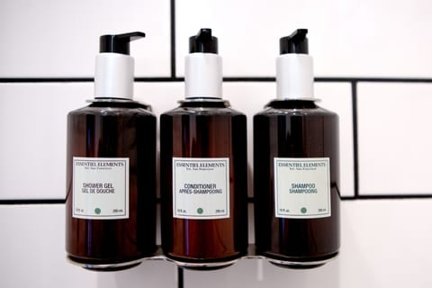 Shower, designer toiletries, towels