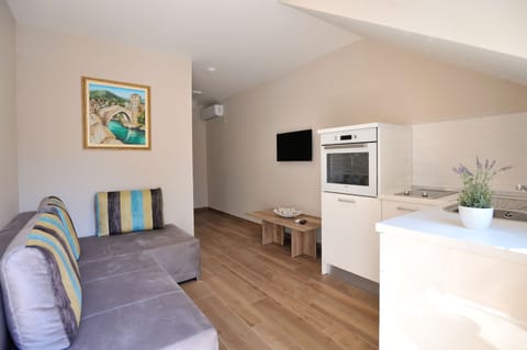 Apartment | Private kitchen | Microwave, electric kettle, highchair