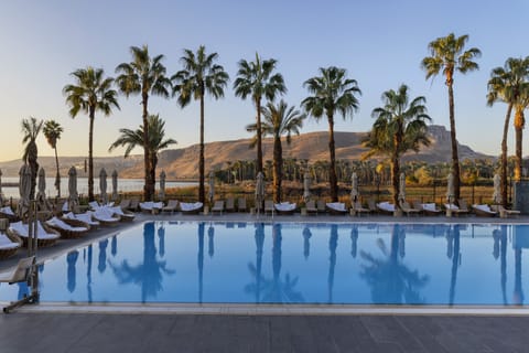 Indoor pool, outdoor pool, open 9:00 AM to 6:00 PM, pool umbrellas