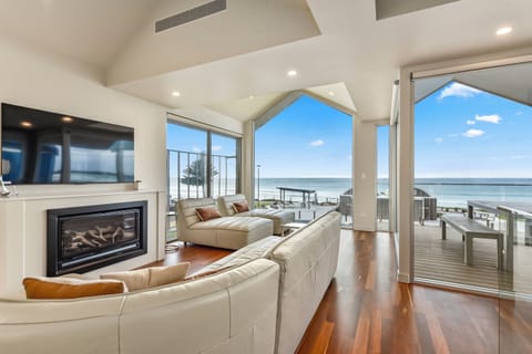 Premium House | Living area | 65-inch Smart TV with digital channels, fireplace